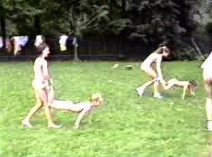 A nudist gathering at the stadium and sports - Many naked men and women