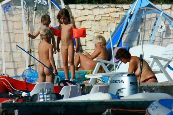 By the boat photos - Nudity is perceived as a natural expression of life