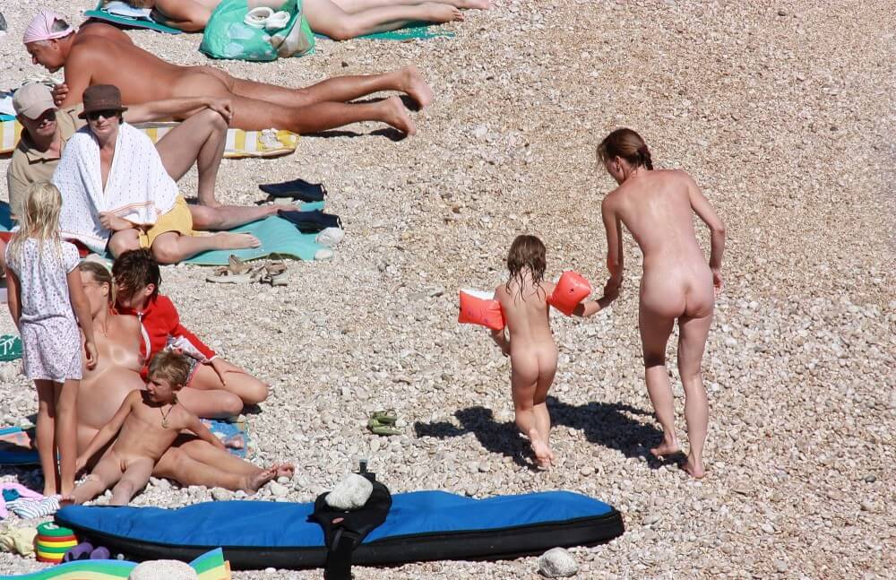 Orange Floaty Safety First Naturist pics - Interaction with nature through naturism and nudism